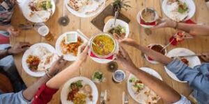 a group of people eating at a table